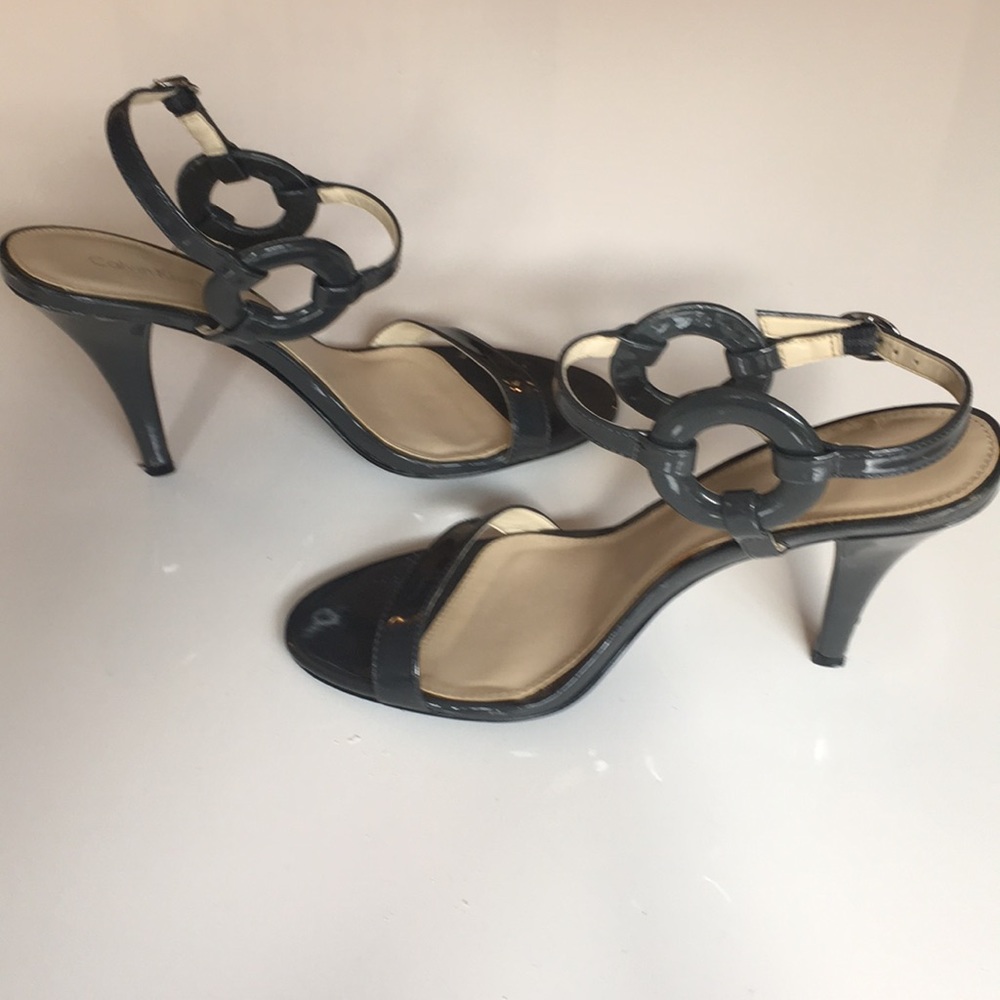 Patent leather decorative strappy heels.